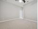 Neutral bedroom with plush carpeting, ceiling fan, and white trim at 10825 Charmwood Dr, Riverview, FL 33569