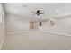 Spacious carpeted bedroom with high ceilings and an open layout at 10825 Charmwood Dr, Riverview, FL 33569
