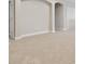 Spacious bonus room with neutral paint, carpet, and archway access at 10825 Charmwood Dr, Riverview, FL 33569