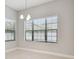Bright dining room with ample natural light and tile flooring at 10825 Charmwood Dr, Riverview, FL 33569