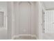 Hallway nook with neutral paint, carpeting and arch detail at 10825 Charmwood Dr, Riverview, FL 33569