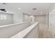 Hallway with plush carpeting and white trim at 10825 Charmwood Dr, Riverview, FL 33569