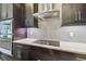 Well-equipped kitchen with stainless steel appliances, sleek countertops, and stylish backsplash at 10825 Charmwood Dr, Riverview, FL 33569