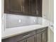 Kitchen cabinets with stylish backsplash and countertops at 10825 Charmwood Dr, Riverview, FL 33569