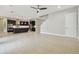 Spacious open-concept living and kitchen area with tile flooring, recessed lighting, and modern design at 10825 Charmwood Dr, Riverview, FL 33569