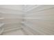 Walk-in pantry with white wire shelving for ample storage at 10825 Charmwood Dr, Riverview, FL 33569