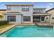 Inviting backyard pool and spa with brick pavers surround the home's outdoor living space at 10825 Charmwood Dr, Riverview, FL 33569