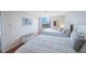 Bright bedroom featuring two twin beds, tile floors, and a view at 6051 Sun Blvd # 504, St Petersburg, FL 33715
