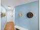 Light and airy hallway design featuring hat racks and a bench, creating a warm, welcoming entrance at 6051 Sun Blvd # 504, St Petersburg, FL 33715