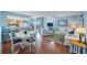 Open concept living space with dining area, modern kitchen, comfortable seating and water views at 6051 Sun Blvd # 504, St Petersburg, FL 33715