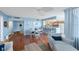 Open concept living space with dining area, breakfast bar, modern kitchen, and stylish decor at 6051 Sun Blvd # 504, St Petersburg, FL 33715