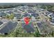 Expansive aerial view of a residential community with well-maintained homes and landscaping at 7532 Ashbrooke Pine Loop, Odessa, FL 33556