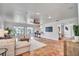 Spacious living room features tile flooring, a ceiling fan, and sliding glass doors to the screened lanai at 11624 Monette Rd, Riverview, FL 33569