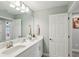 Bright bathroom with double sinks, a large mirror, and ample counter space at 14838 Paddock Pond Ave, Lithia, FL 33547