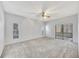 Spacious bedroom with neutral carpet and large sliding door at 1803 Tawnee Pl, Brandon, FL 33510