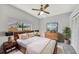 Comfortable bedroom with wood furniture and large window at 1803 Tawnee Pl, Brandon, FL 33510