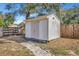 Image of the storage shed with a path and some foliage at 1803 Tawnee Pl, Brandon, FL 33510