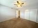 Bedroom with neutral walls, a ceiling fan, and a large closet at 2284 Spanish Dr # 26, Clearwater, FL 33763