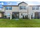 Backyard with a patio, green grass and view of the home at 29913 Southwell Ln, Wesley Chapel, FL 33543