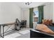 Bright bedroom with natural light, comfortable bed, desk and curtains, perfect for relaxation at 29913 Southwell Ln, Wesley Chapel, FL 33543