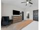 Serene main bedroom featuring a ceiling fan, soft carpet, and ample closet space at 29913 Southwell Ln, Wesley Chapel, FL 33543