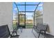 Relaxing patio with comfortable seating and screened enclosure for outdoor enjoyment at 29913 Southwell Ln, Wesley Chapel, FL 33543