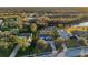 Aerial view of landscaped property and the backyard, which is complete with a pool at 3870 155Th E Ave, Parrish, FL 34219