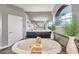 Luxurious bathroom with an oval tub, tiled floors, a large mirror, and decorative plants at 3870 155Th E Ave, Parrish, FL 34219
