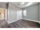 Bright bedroom featuring wood-look floors, a window, and a closet for ample storage space at 3870 155Th E Ave, Parrish, FL 34219