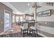 Open concept dining area with access to the kitchen, backyard, and natural light at 3870 155Th E Ave, Parrish, FL 34219