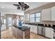 Bright kitchen features granite countertops, stainless steel appliances, central island, and stylish tile flooring at 3870 155Th E Ave, Parrish, FL 34219