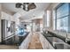 A spacious kitchen is complete with stainless steel refrigerator and granite countertops on a center island at 3870 155Th E Ave, Parrish, FL 34219