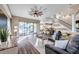 Inviting living room features hardwood floors, neutral paint, and sliding glass doors with a backyard view at 3870 155Th E Ave, Parrish, FL 34219