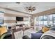 Inviting living room with a ceiling fan, comfortable sofas, and sliding glass doors to the backyard pool at 3870 155Th E Ave, Parrish, FL 34219