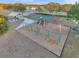Outdoor playground featuring swings, slides, and a basketball court, perfect for Gathering fun at 3870 155Th E Ave, Parrish, FL 34219