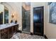 Stylish bathroom boasts a dark wood vanity, decorative tile flooring, and a glass-enclosed shower at 3901 Bayshore Ne Blvd, St Petersburg, FL 33703