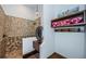 Bathroom featuring custom tile in the glass shower, stone sink, towels, hooks and decorative lighting at 3901 Bayshore Ne Blvd, St Petersburg, FL 33703