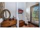 Bathroom showcasing stone flooring, a stone sink, custom mirror, and a doorway to the toilet at 3901 Bayshore Ne Blvd, St Petersburg, FL 33703