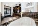 Bathroom featuring dark cabinetry, granite countertops, and a large soaking tub at 3901 Bayshore Ne Blvd, St Petersburg, FL 33703