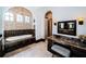 Elegant bathroom with a soaking tub framed by arched windows and dark wood cabinetry at 3901 Bayshore Ne Blvd, St Petersburg, FL 33703