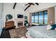 Bedroom featuring a fireplace, water view, ceiling fan, and dark hardwood floors at 3901 Bayshore Ne Blvd, St Petersburg, FL 33703