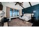 Main bedroom with water view, dark hardwood floors, ceiling fan and custom wall features at 3901 Bayshore Ne Blvd, St Petersburg, FL 33703