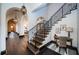 Elegant entryway with decorative staircase, arched doorways, and dark wood flooring at 3901 Bayshore Ne Blvd, St Petersburg, FL 33703