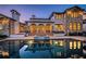 Luxury home featuring a stunning backyard pool reflecting the home's architectural details and a tranquil outdoor setting at 3901 Bayshore Ne Blvd, St Petersburg, FL 33703