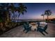 Backyard features a stone fire pit with waterfront view, a great spot to relax and entertain guests at 3901 Bayshore Ne Blvd, St Petersburg, FL 33703