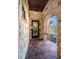 Covered front porch with stone walls, brick archways and tile flooring at 3901 Bayshore Ne Blvd, St Petersburg, FL 33703