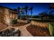 Inviting front yard with stone accents, lush landscaping, a serene fountain and a winding paver walkway at 3901 Bayshore Ne Blvd, St Petersburg, FL 33703