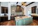 Gourmet kitchen featuring a large island, designer cabinets, and terracotta flooring at 3901 Bayshore Ne Blvd, St Petersburg, FL 33703