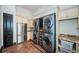 Convenient laundry room with stacked washer/dryer units, sink, and storage cabinets at 3901 Bayshore Ne Blvd, St Petersburg, FL 33703