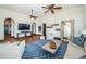 Bright living room with terracotta floors, ceiling fans, and comfortable seating at 3901 Bayshore Ne Blvd, St Petersburg, FL 33703